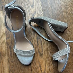 Silver rhinestone woman’s heels